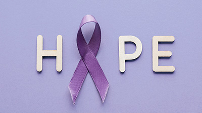 the word "hope" spelled out against a purple color background.