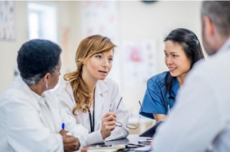 Clinicians discussing patient care