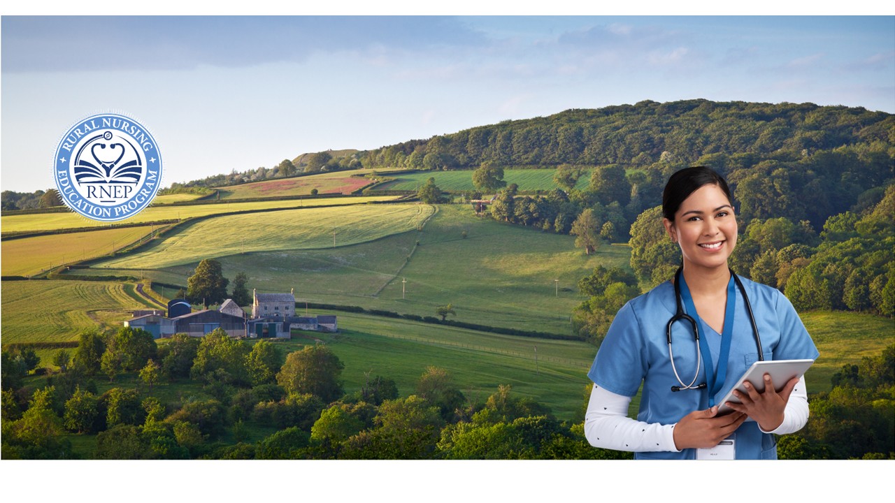 Young female nurse in blue scrubs wearing stethoscope smiles holding tablet in front of vast rural background showing a home and green fields.