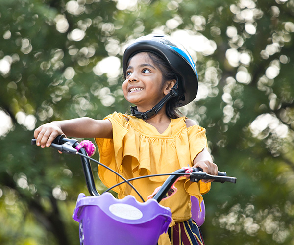 young child of color riding a bike