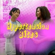 A women doctor talking to a women patient.